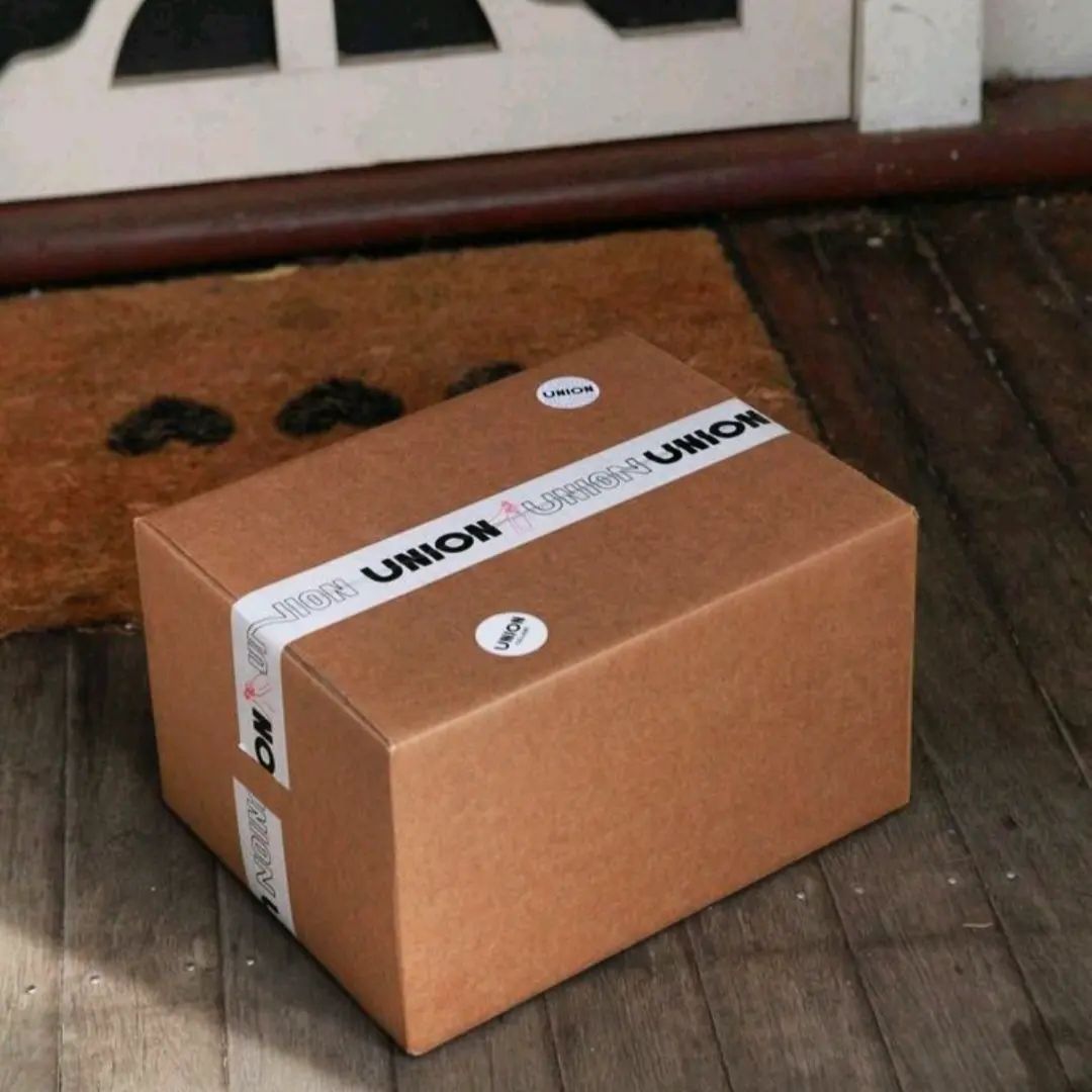 A parcel of wine on a doorstep.